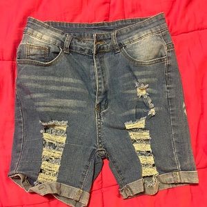 Long woman’s ripped shorts